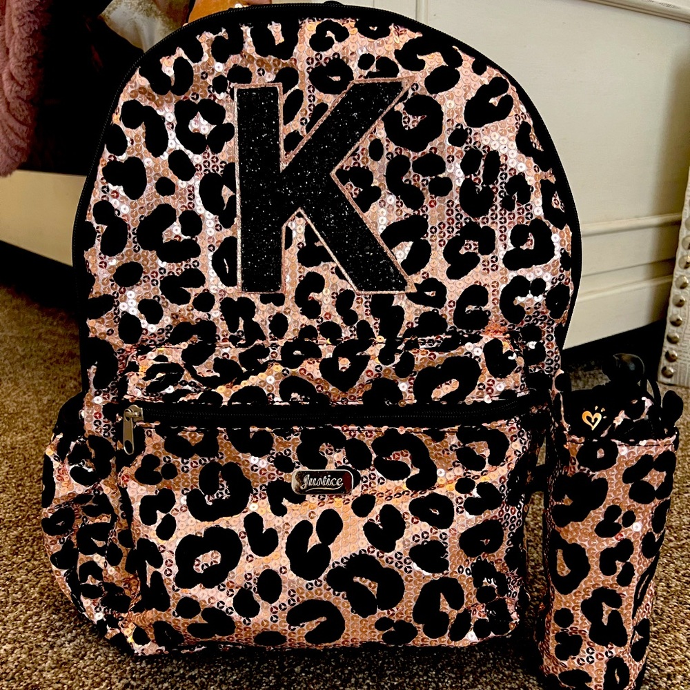 Justice “K” girls backpack with insulated water bottle holder.